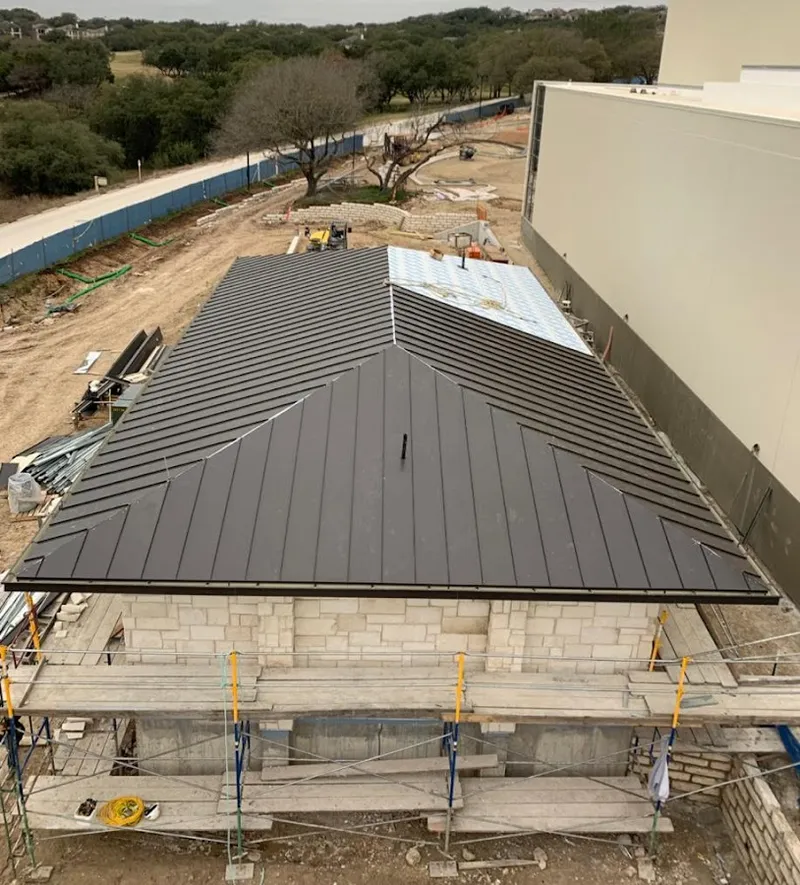 Metal roof new construction with scaffolding in Worcester